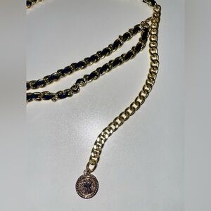 Chain belt with charm.